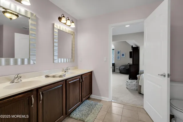 a view of a chair and table in the patio next to a yard