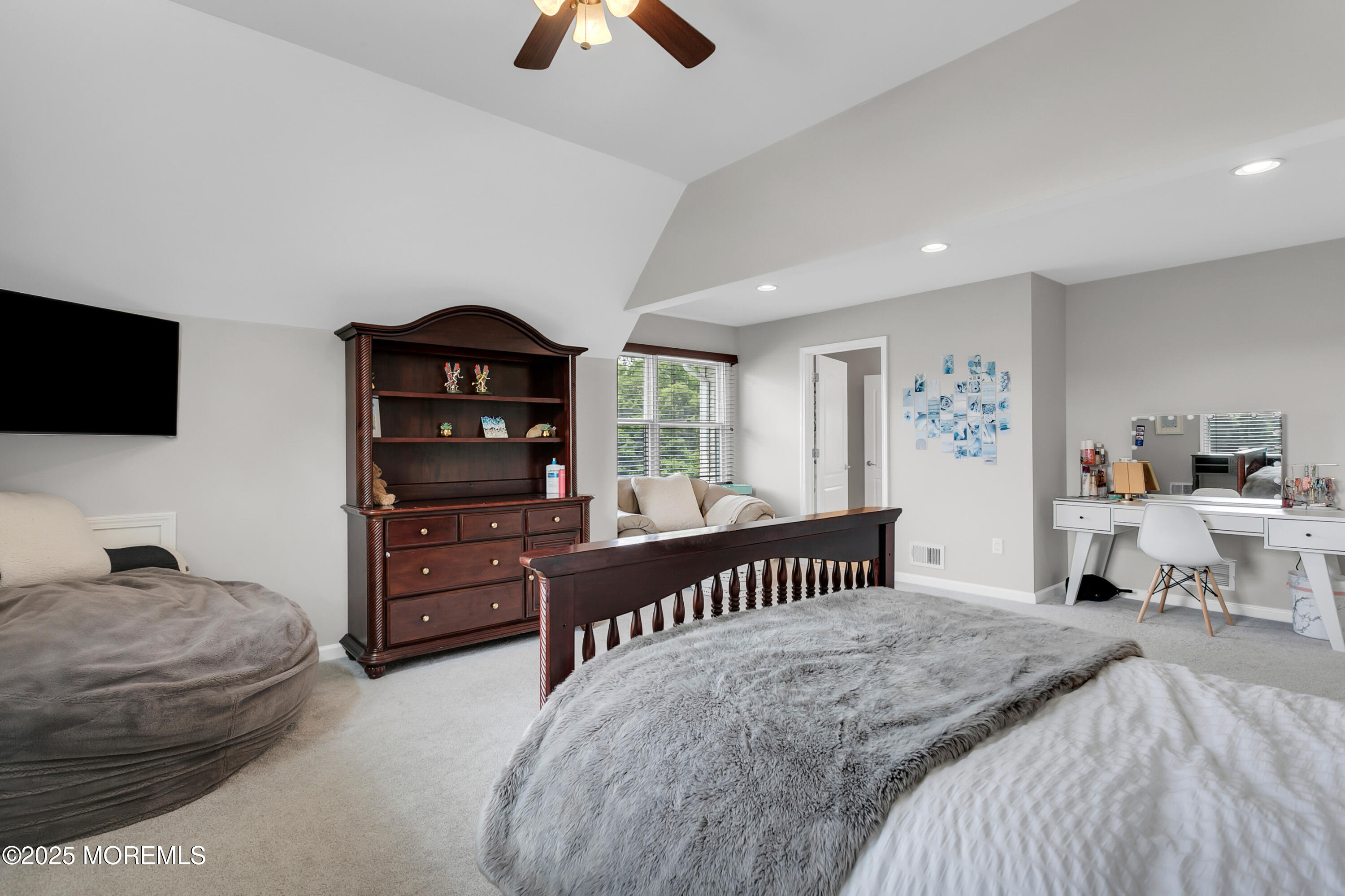 529 Woodview Road Toms River, NJ 08755 - Photo 44 of 85 a bedroom with a bed and a flat screen tv