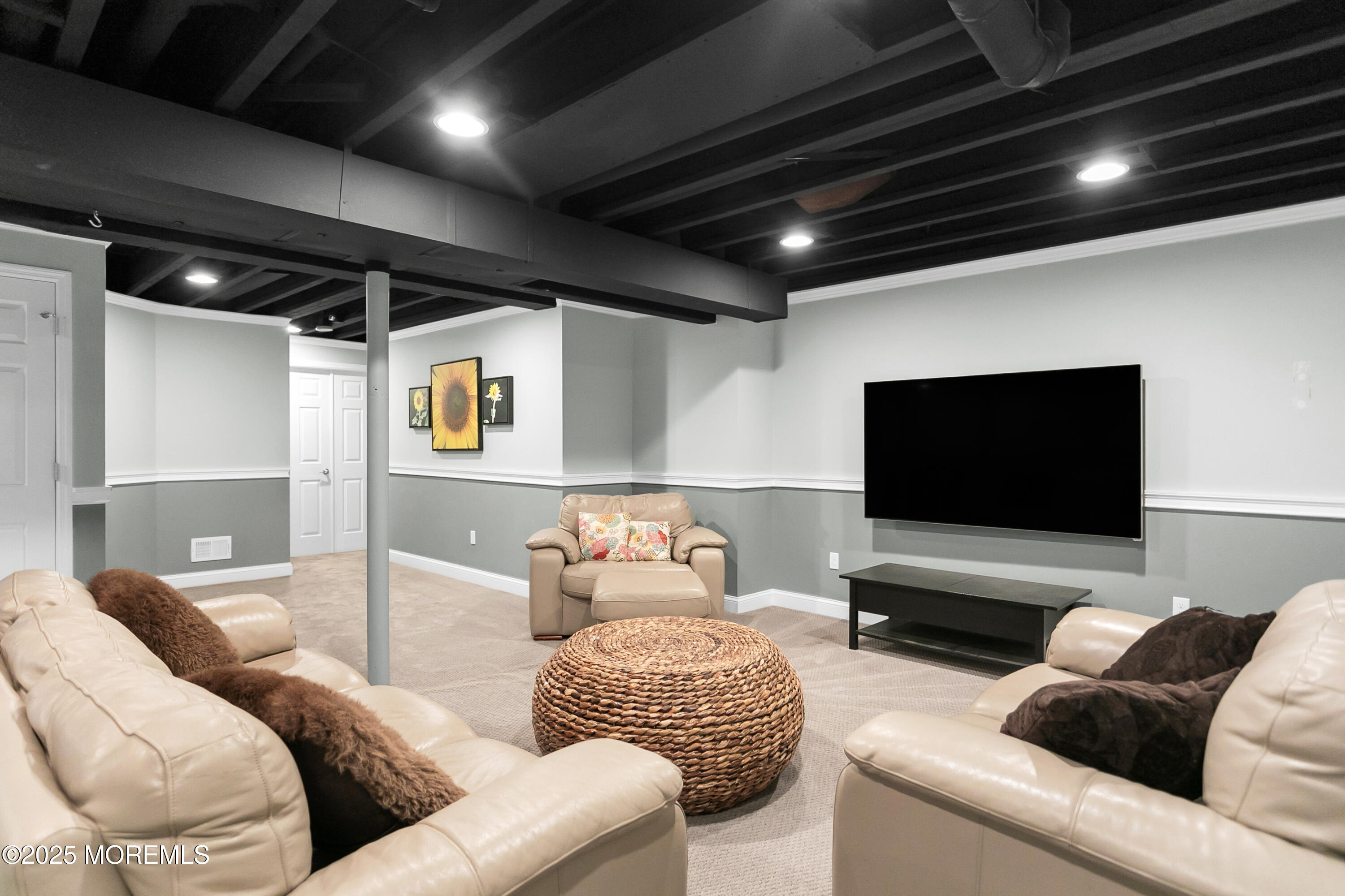 529 Woodview Road Toms River, NJ 08755 - Photo 45 of 85 a living room with furniture and a flat screen tv