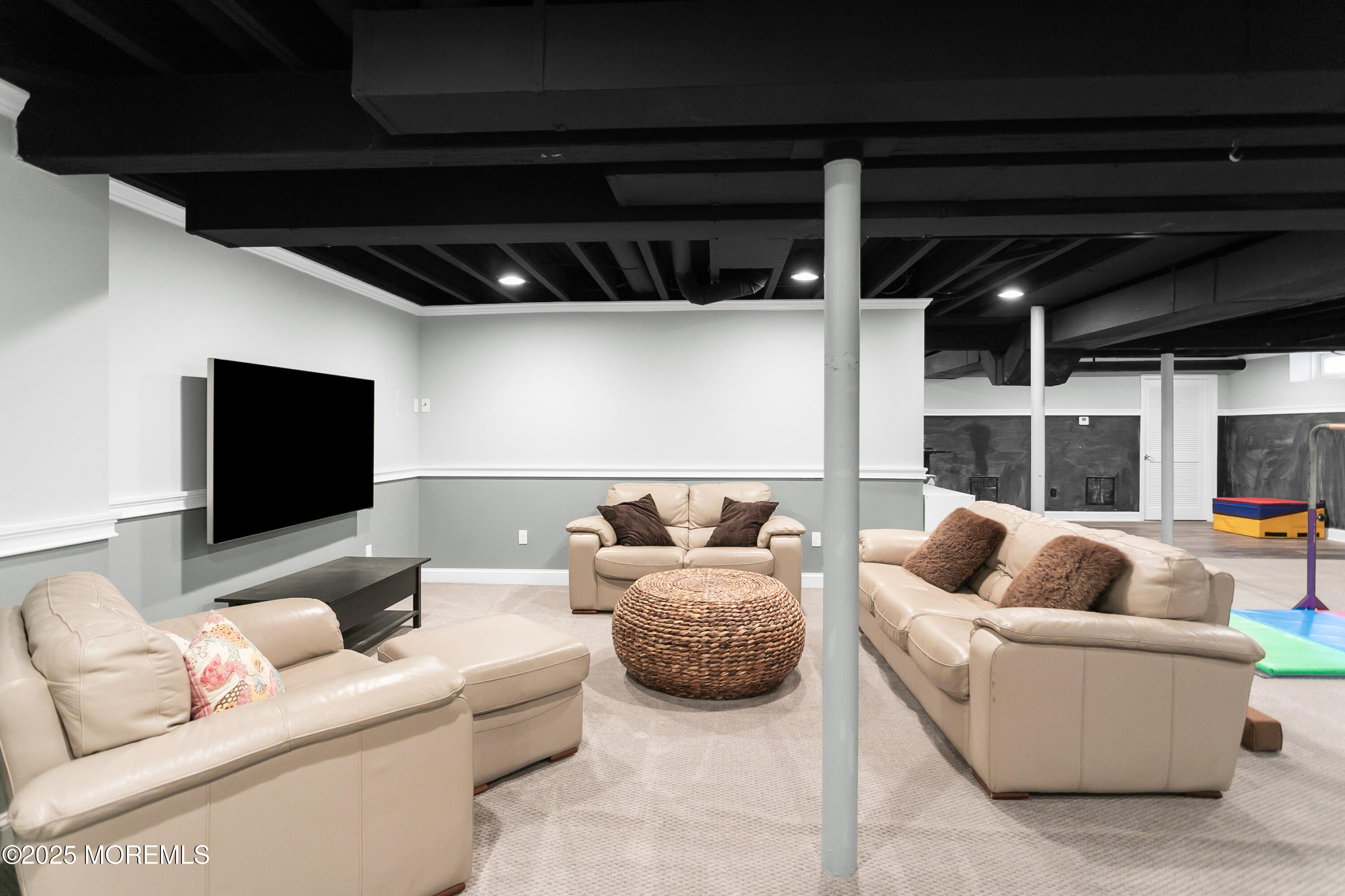 529 Woodview Road Toms River, NJ 08755 - Photo 46 of 85 a living room with furniture and a flat screen tv