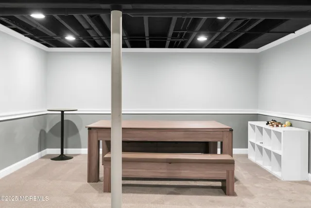 a view of a house with a yard and sitting area