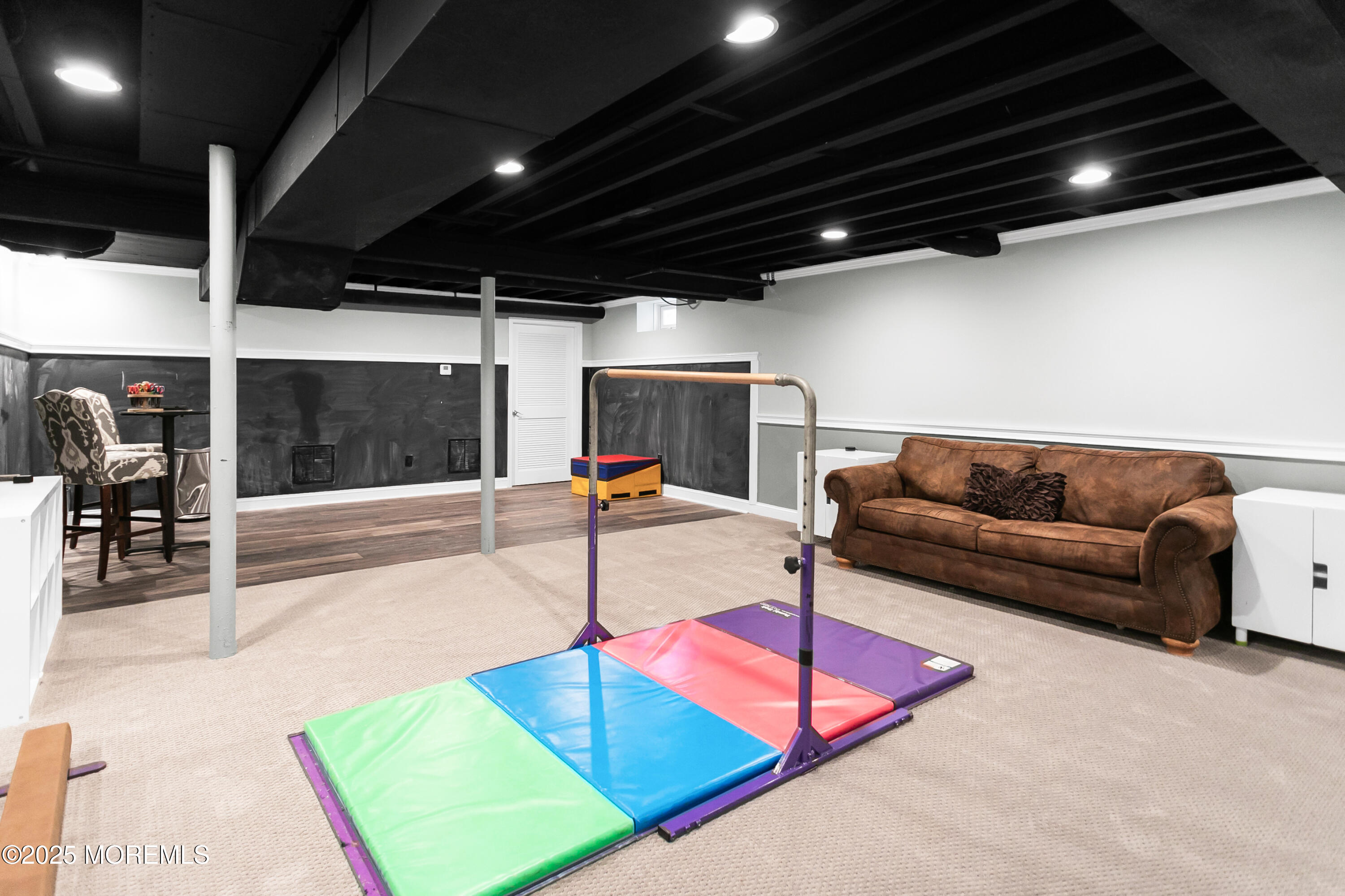 529 Woodview Road Toms River, NJ 08755 - Photo 48 of 85 a living room with furniture pool table and a projector with kitchen view