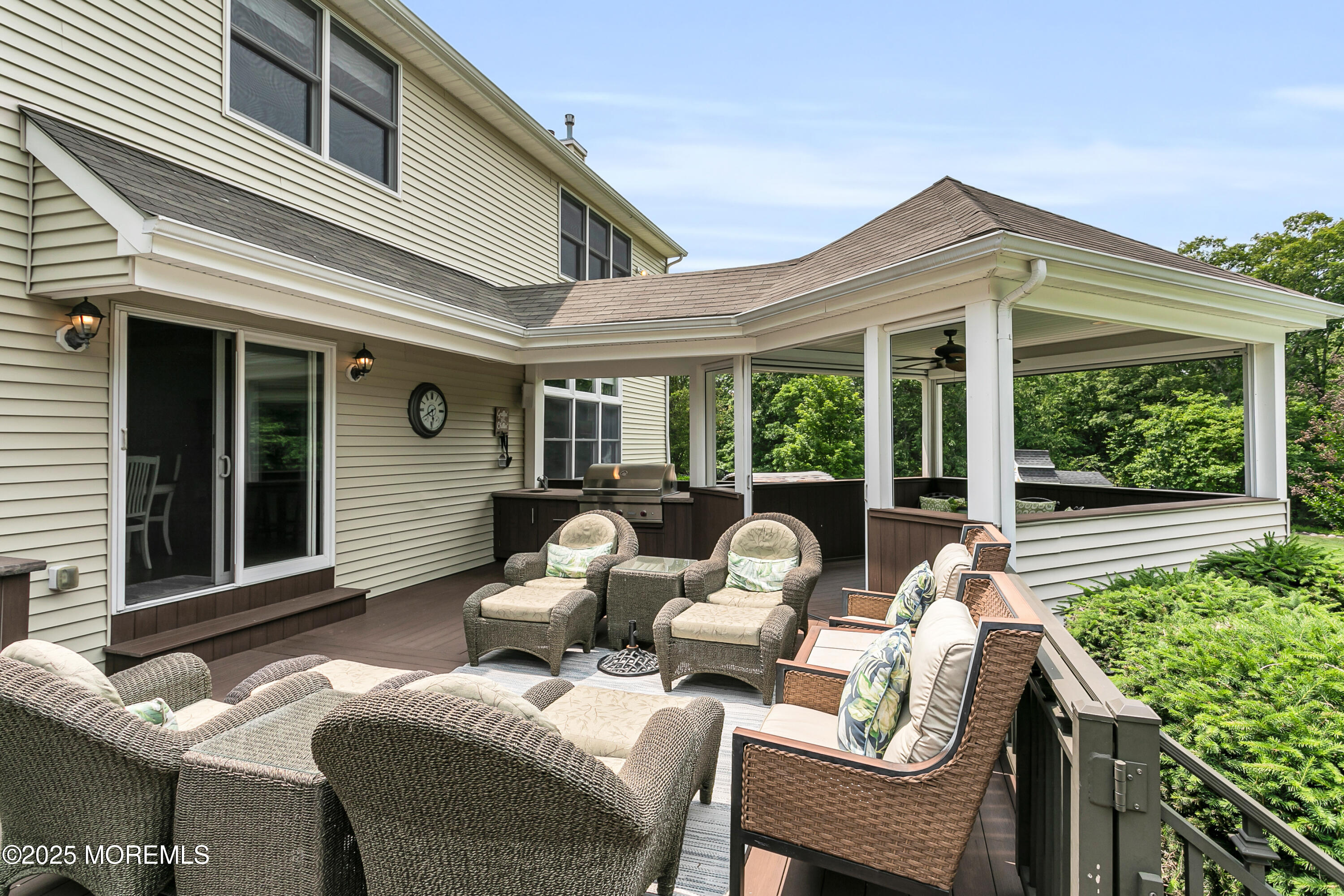 529 Woodview Road Toms River, NJ 08755 - Photo 51 of 85 a view of a patio with couches chairs and floor to ceiling window and potted plants