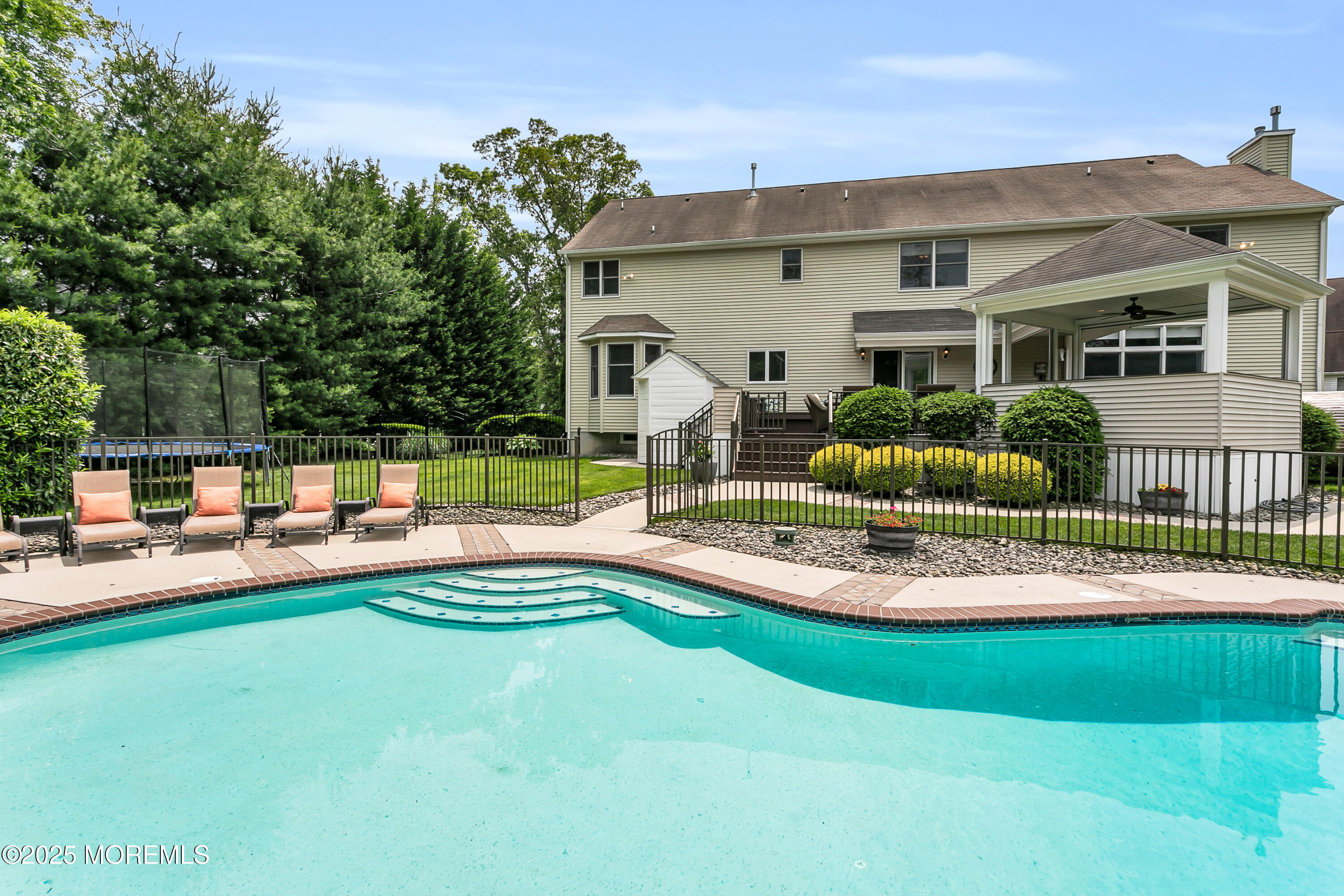 529 Woodview Road Toms River, NJ 08755 - Photo 61 of 85 a front view of a house with a yard table and chairs