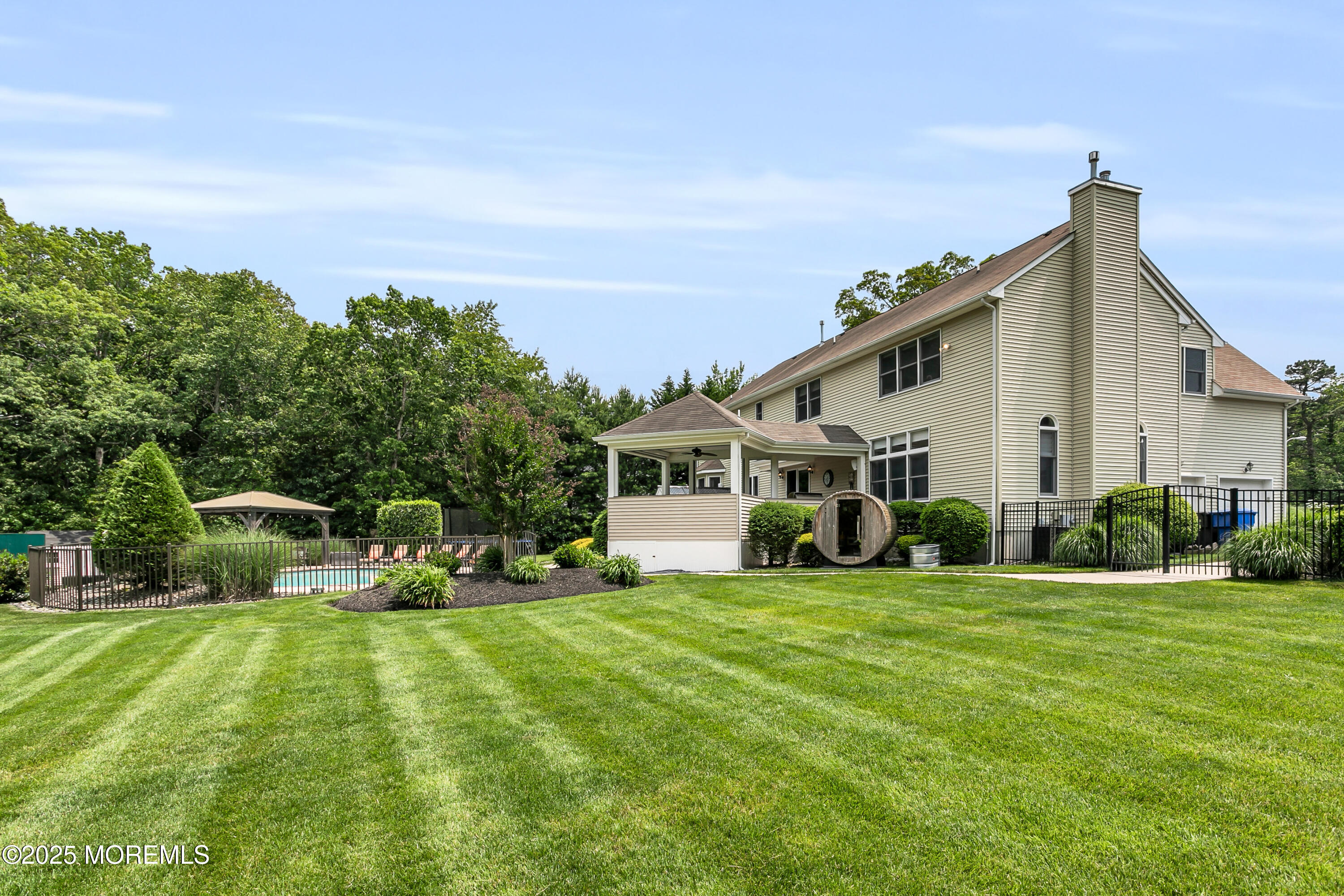 529 Woodview Road Toms River, NJ 08755 - Photo 76 of 85 a view of a house with a yard and sitting area
