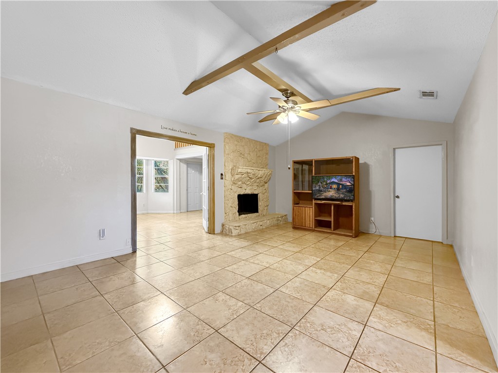 910 Twite Circle Corpus Christi, TX 78418 - Photo 16 of 40 a view of a livingroom with a fireplace and a ceiling fan
