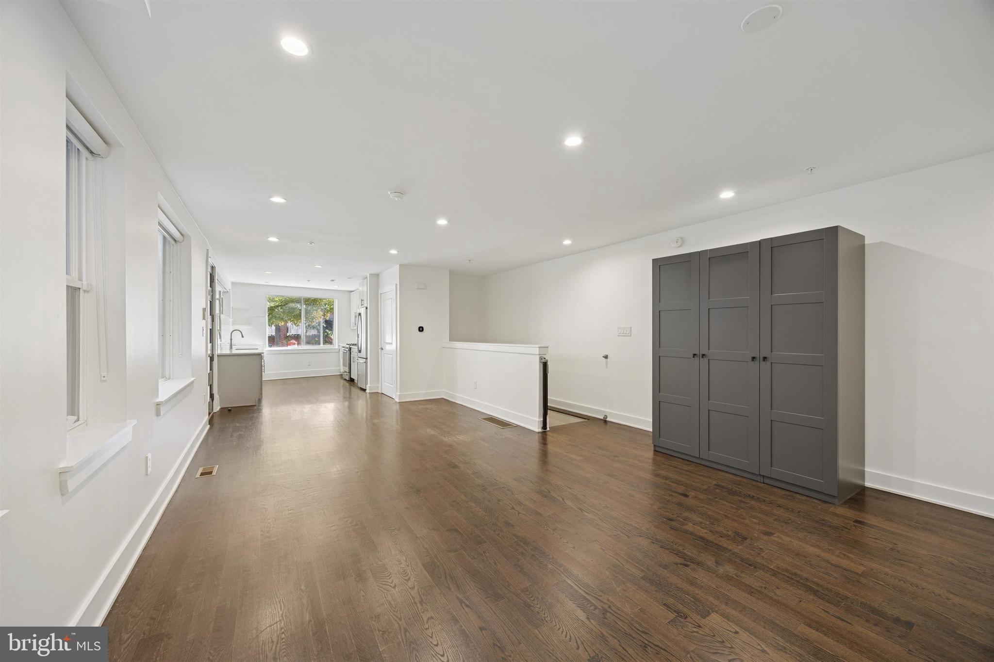 1022 South 2nd Street, Unit 7 Philadelphia, PA 19147 - Photo 7 of 28 a view of an empty room with wooden floor and a window
