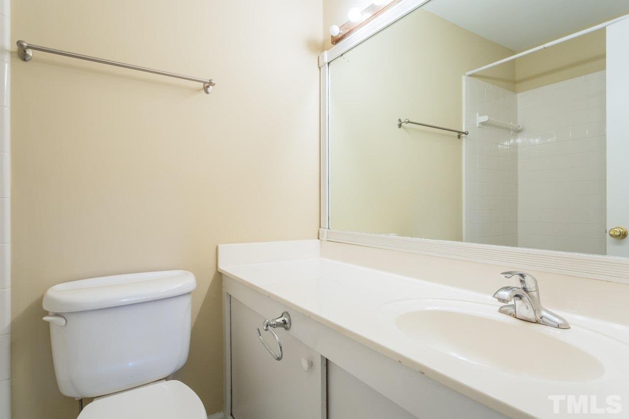 3408 Cherry Lane Raleigh, NC 27607 - Photo 13 of 25 a bathroom with a sink and a toilet