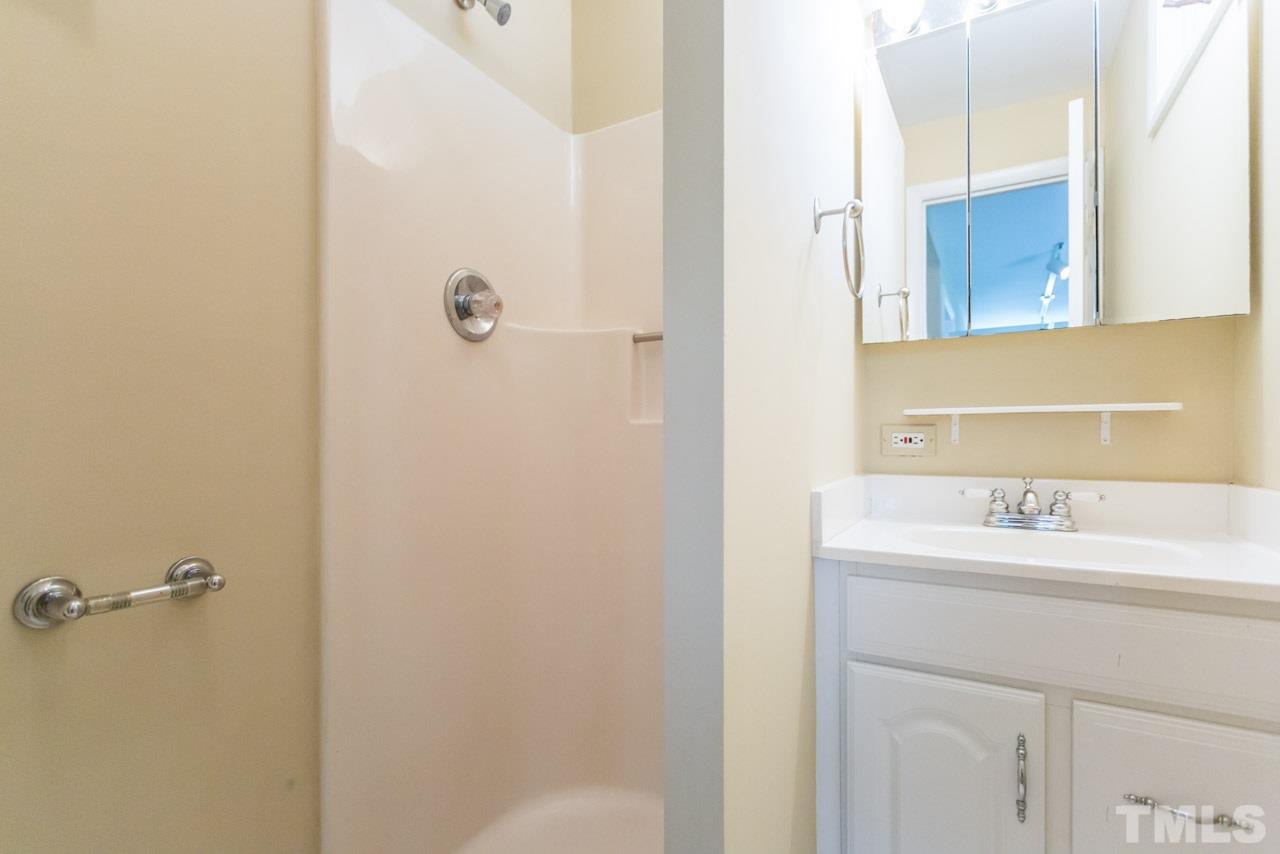 3408 Cherry Lane Raleigh, NC 27607 - Photo 17 of 25 a bathroom with a sink and a mirror