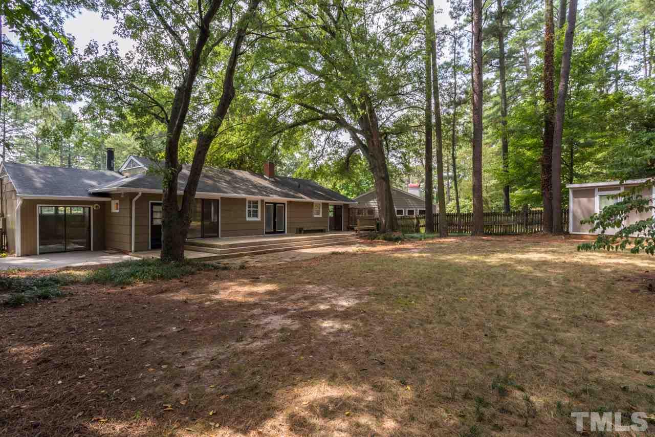 3408 Cherry Lane Raleigh, NC 27607 - Photo 20 of 25 a backyard of a house with lots of green space