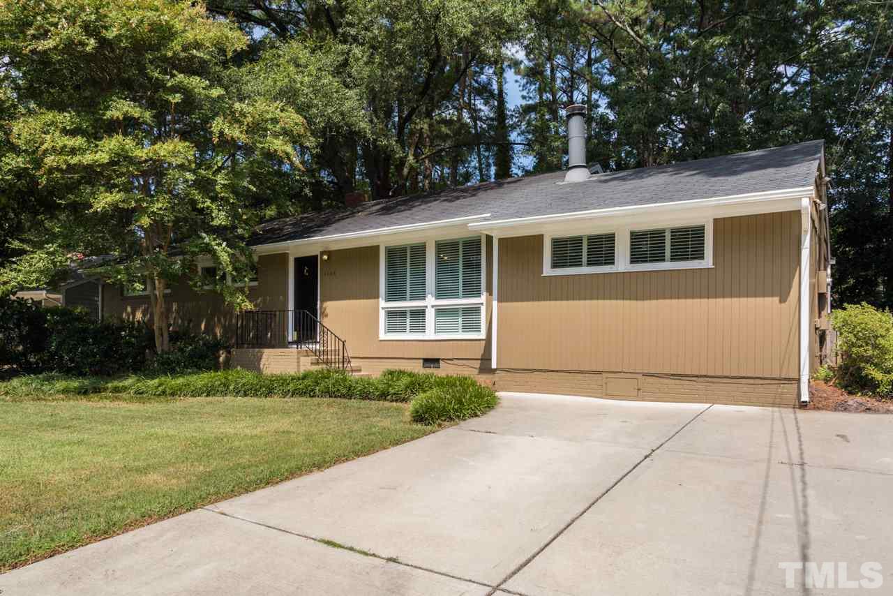 3408 Cherry Lane Raleigh, NC 27607 - Photo 25 of 25 a front view of a house with a garden