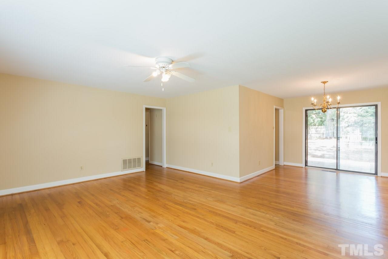 3408 Cherry Lane Raleigh, NC 27607 - Photo 6 of 25 an empty room with wooden floor and window