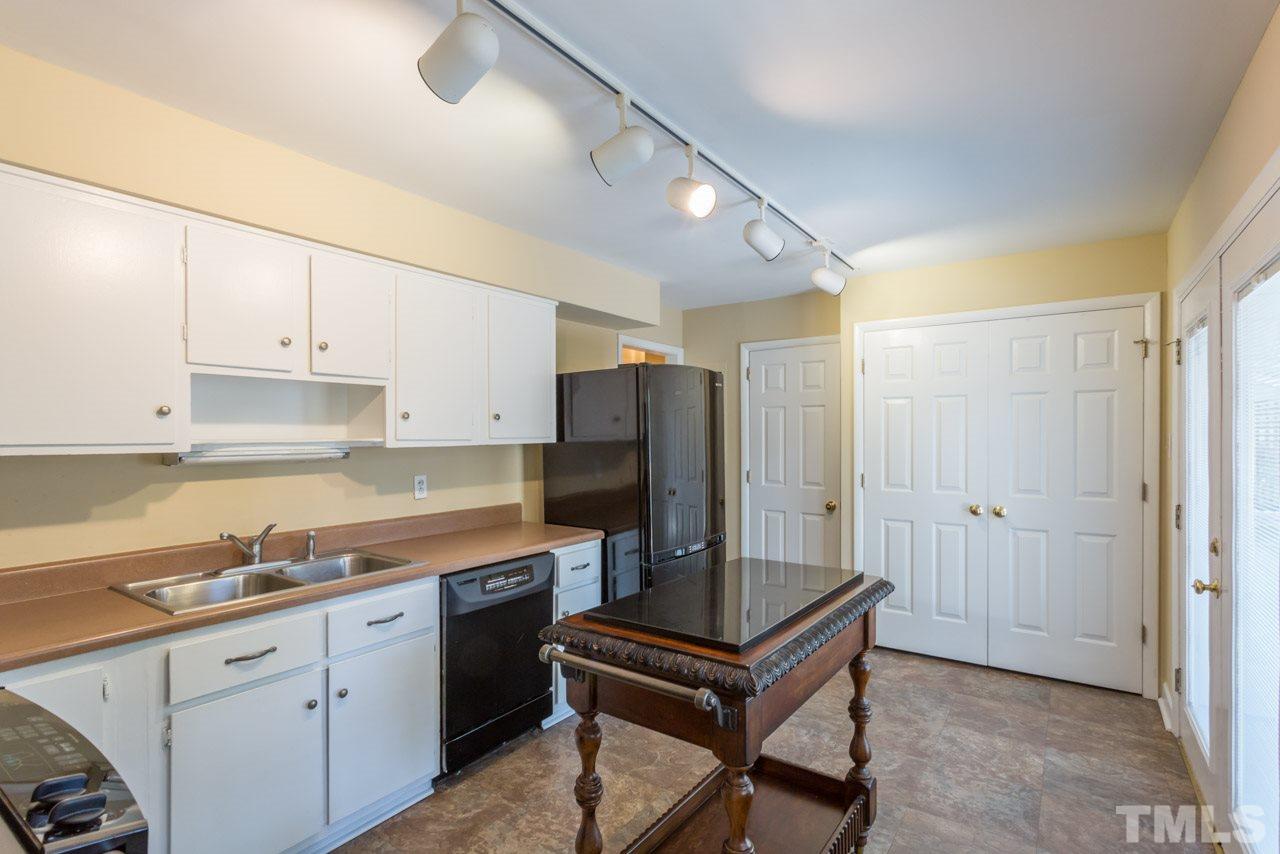 3408 Cherry Lane Raleigh, NC 27607 - Photo 8 of 25 a kitchen with a sink cabinets and refrigerator