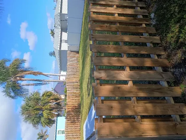 a view of balcony with wooden floor
