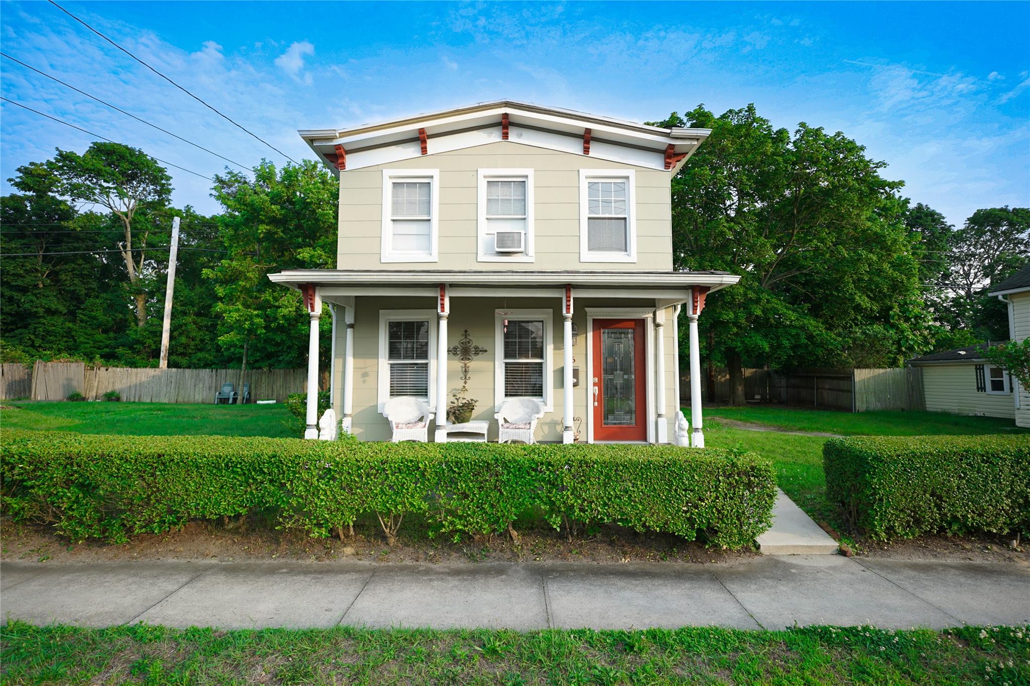 56 Academy Street Patchogue, NY 11772 - Photo 1 of 1 a front view of a house with a yard