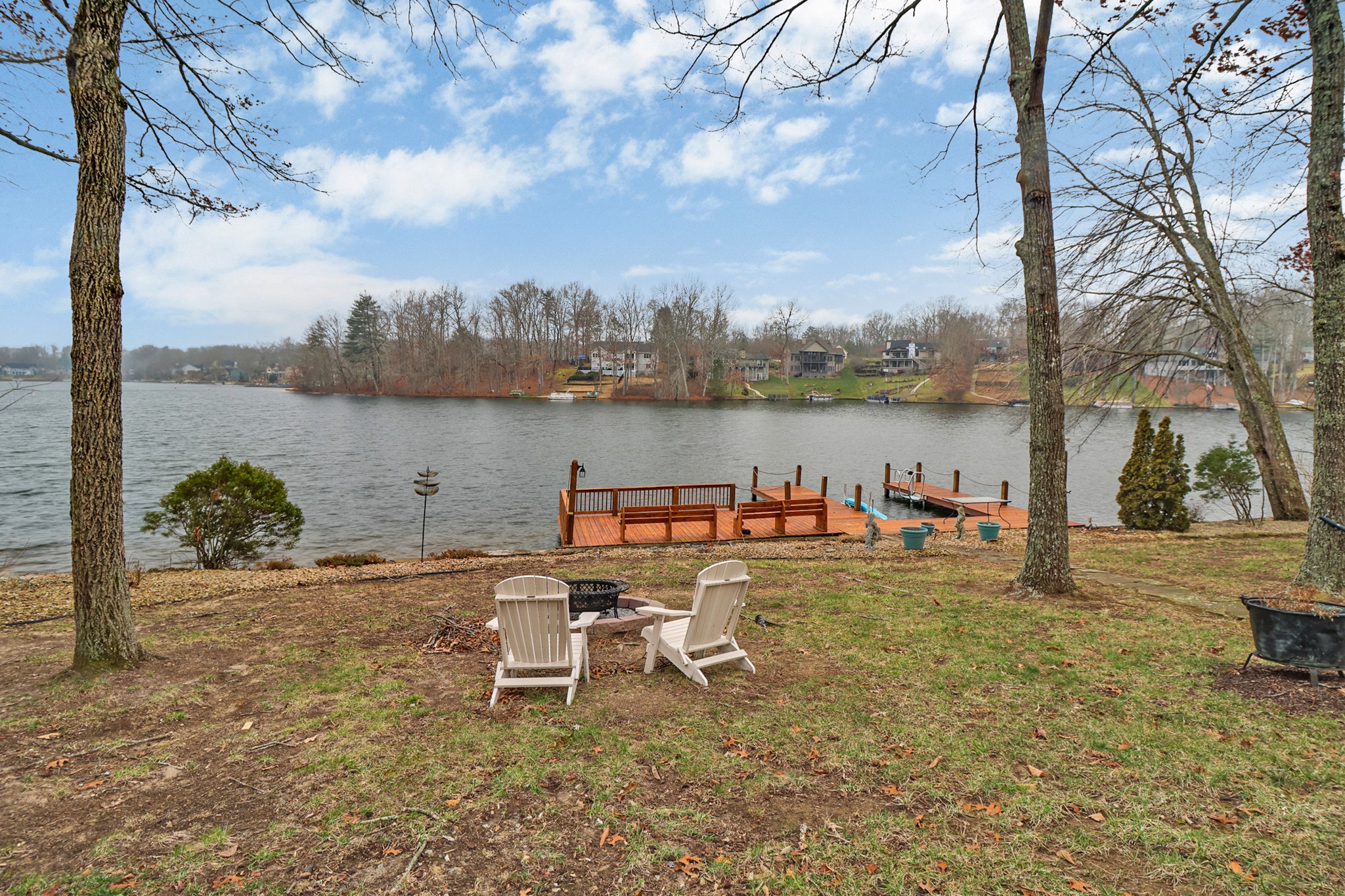 a view of a lake with outdoor seating space