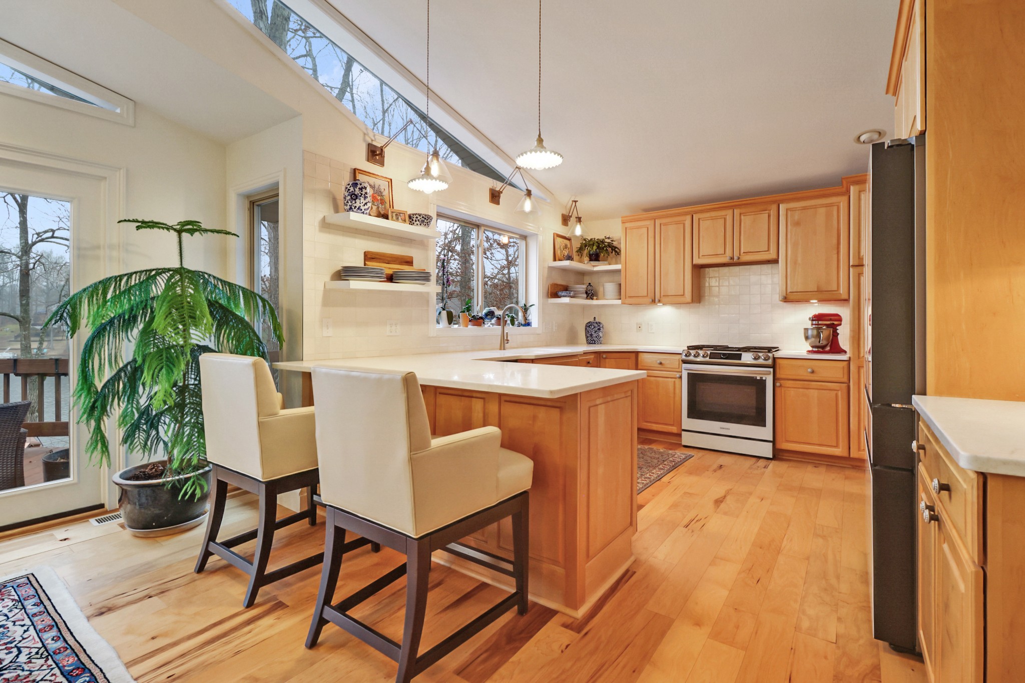 138 Rutgers Circle Crossville, TN 38558 - Photo 11 of 45 a kitchen with stainless steel appliances granite countertop a stove a sink dishwasher and a refrigerator with wooden floor