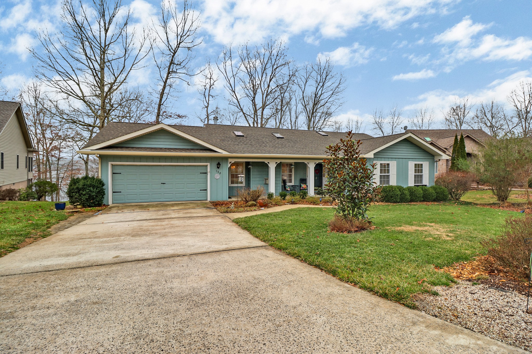 138 Rutgers Circle Crossville, TN 38558 - Photo 31 of 45 a front view of a house with a yard and trees
