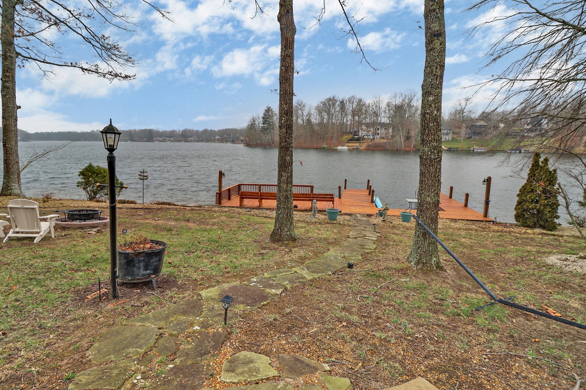 138 Rutgers Circle Crossville, TN 38558 - Photo 37 of 45 a view of a lake with a table and chairs