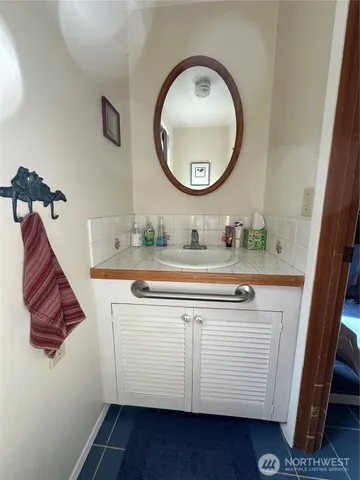 a bathroom with a sink and a mirror