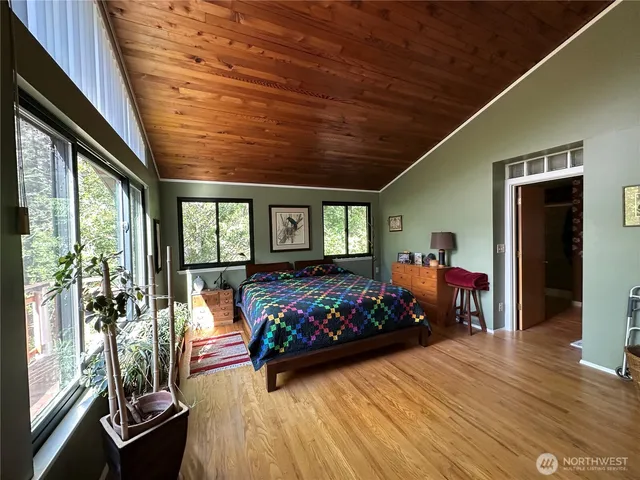 a room with lots of furniture and wooden floor