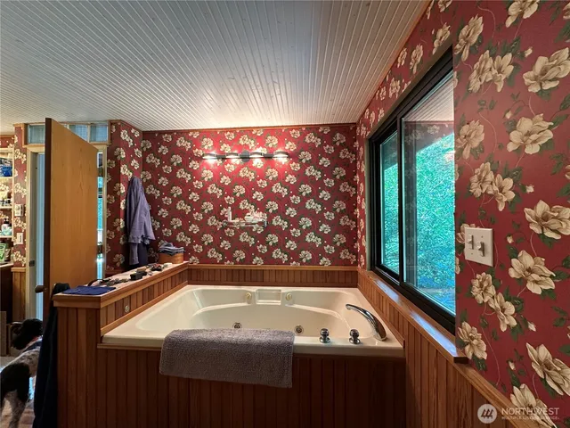 a bathroom with a bathtub and a shower