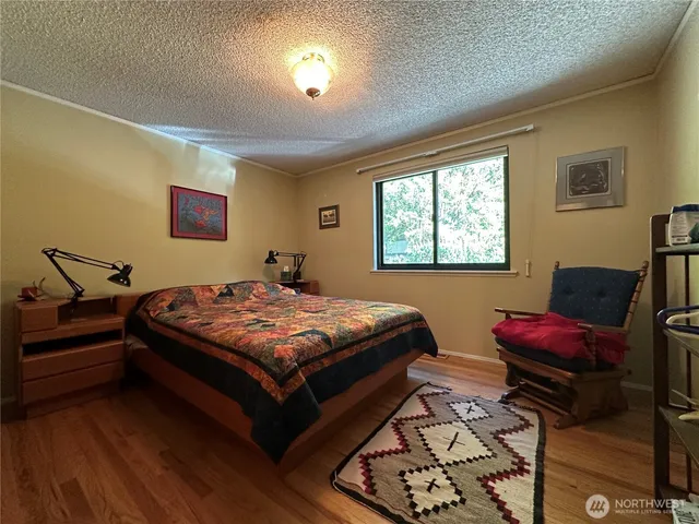 a bedroom with bed and a window