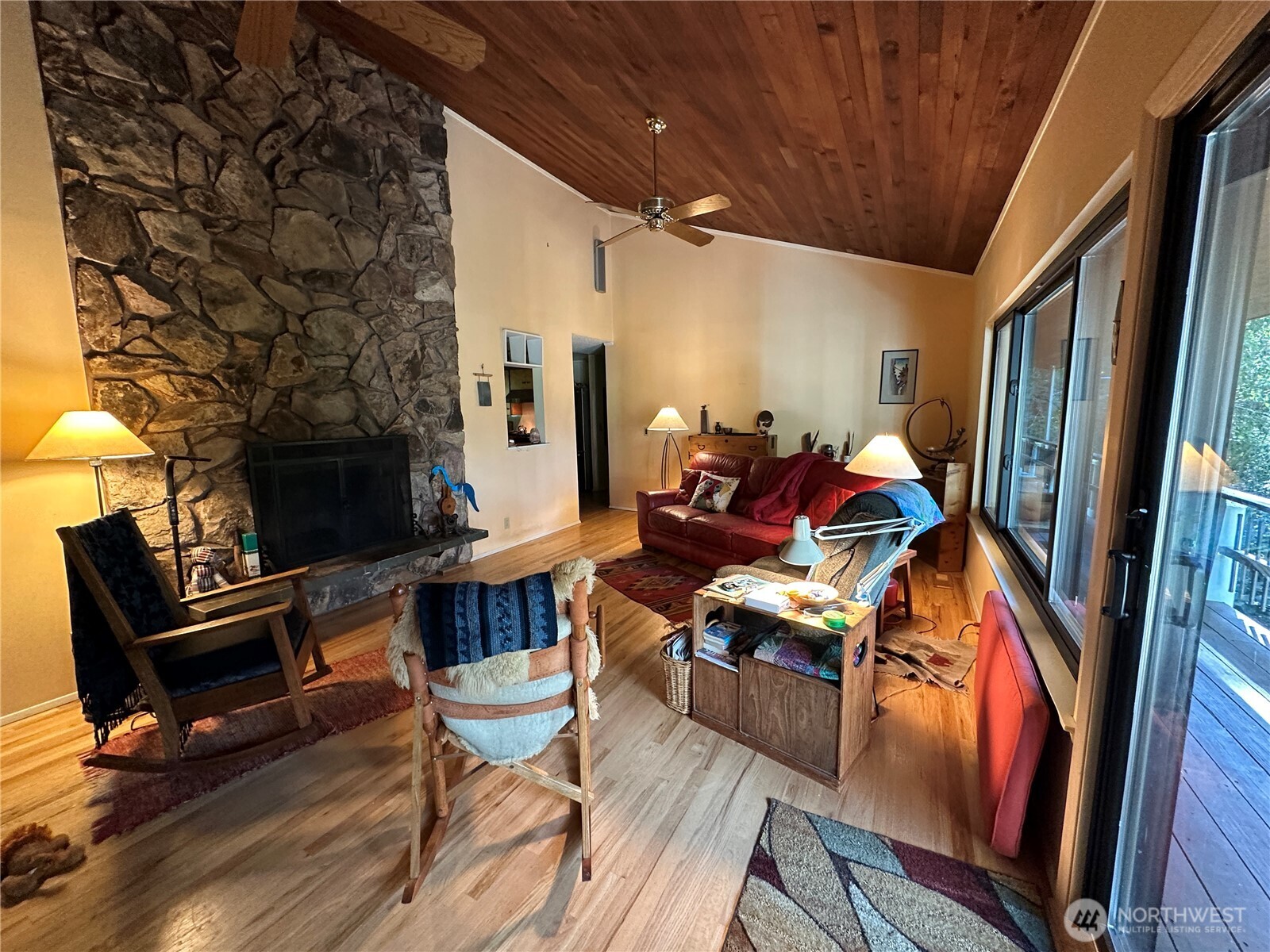 24703 Highway 3 Belfair, WA 98528 - Photo 7 of 39 a living room with furniture a fireplace and a flat screen tv