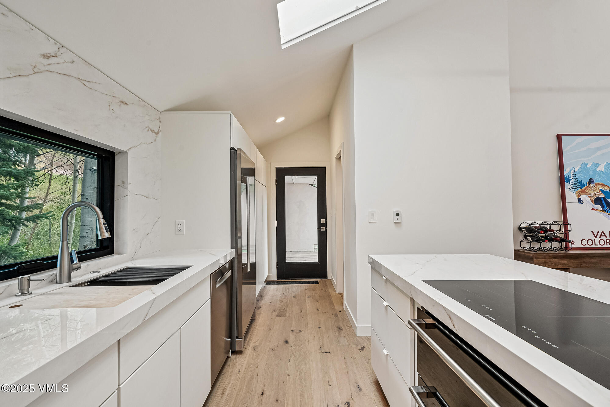 4545 Big Horn Road Vail, CO 81657 - Photo 12 of 49 a kitchen with a sink stove and refrigerator