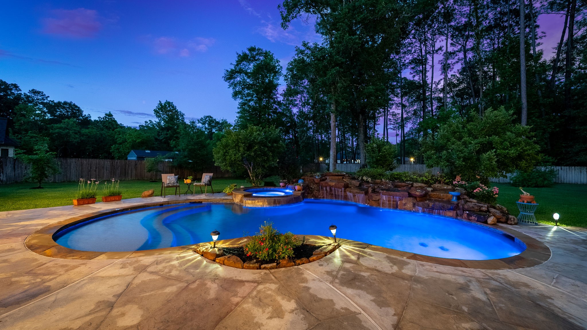 28502 Crawford Ridge Court Huffman, TX 77336 - Photo 43 of 50 a view of a swimming pool with an outdoor space and seating area