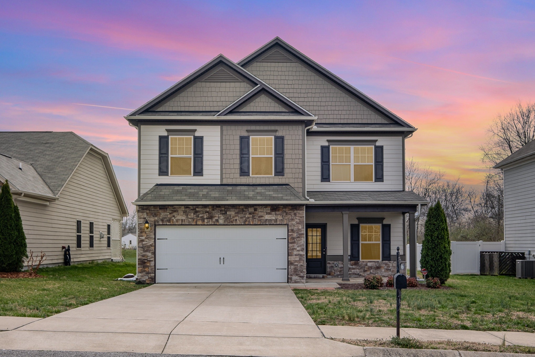 a front view of a house with garden