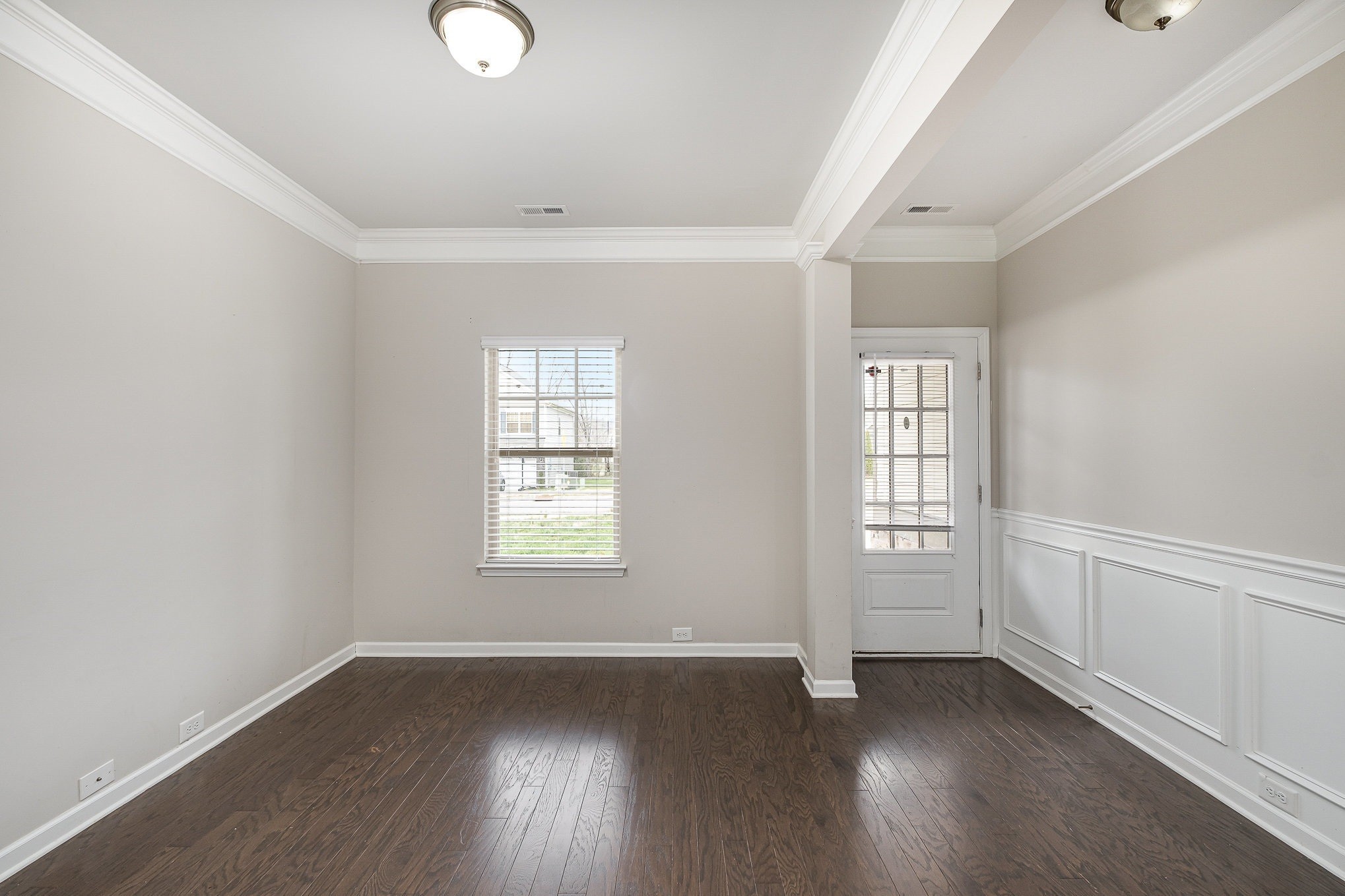 966 Carnation Drive Spring Hill, TN 37174 - Photo 9 of 17 an empty room with wooden floor and windows