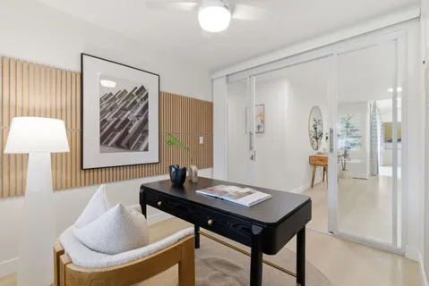 a view of a bathroom with a sink and a mirror