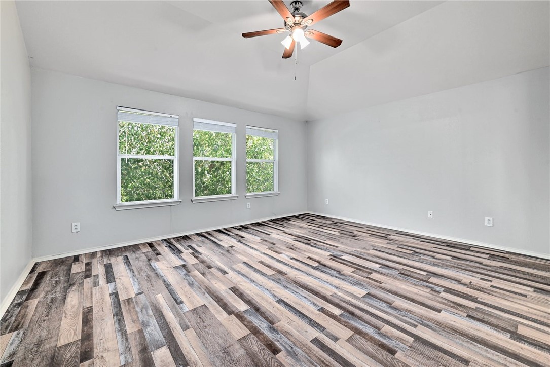 2049 Rachel Lane Round Rock, TX 78664 - Photo 19 of 36 wooden floor in an empty room with a window