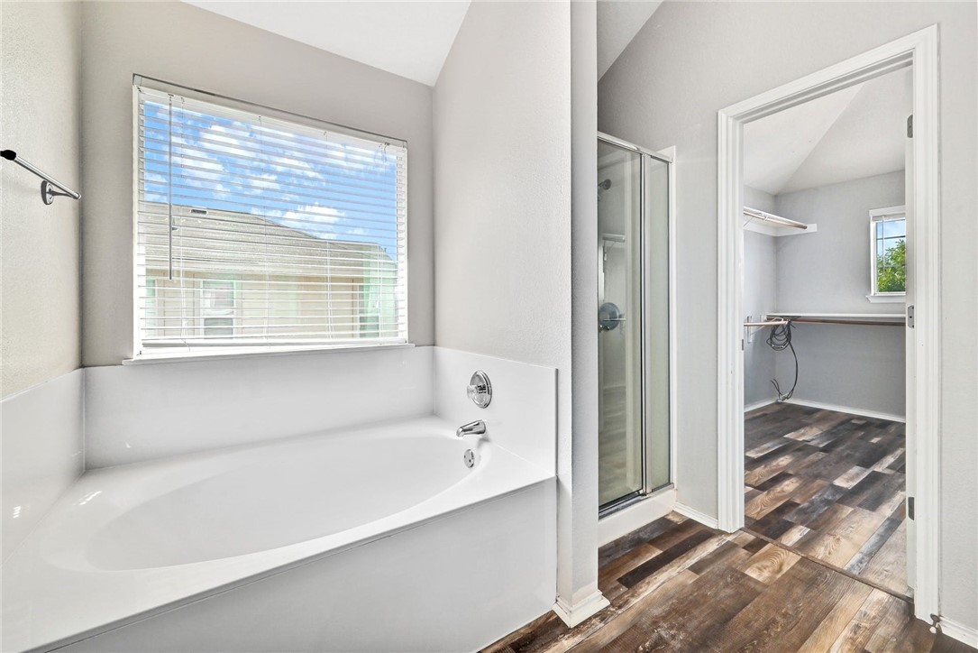 2049 Rachel Lane Round Rock, TX 78664 - Photo 22 of 36 a bathroom with a bathtub and a shower