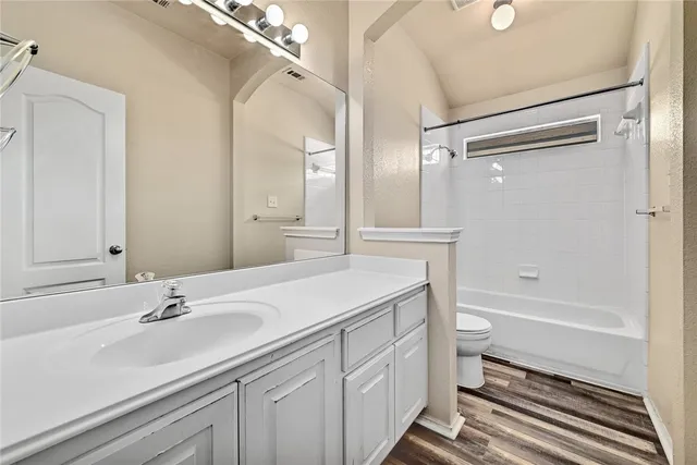 a bathroom with a sink toilet a tub and shower