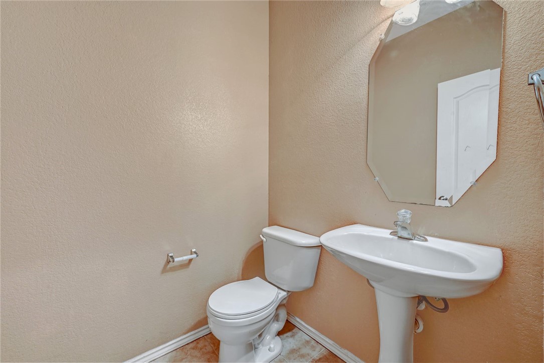 2049 Rachel Lane Round Rock, TX 78664 - Photo 28 of 36 a bathroom with a sink and a toilet