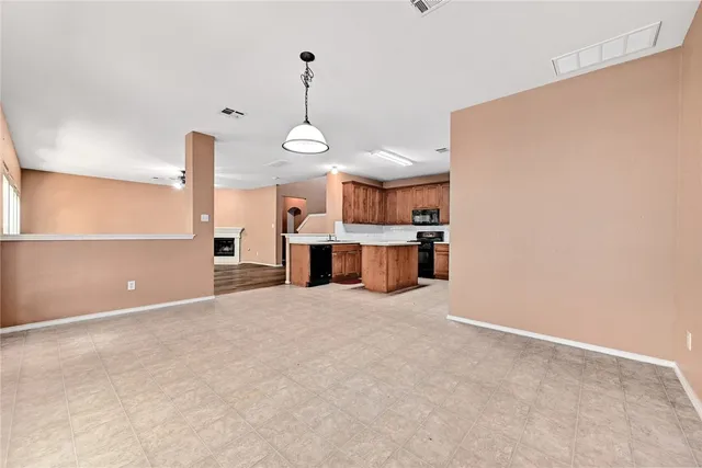 a view of a kitchen with a sink and a window
