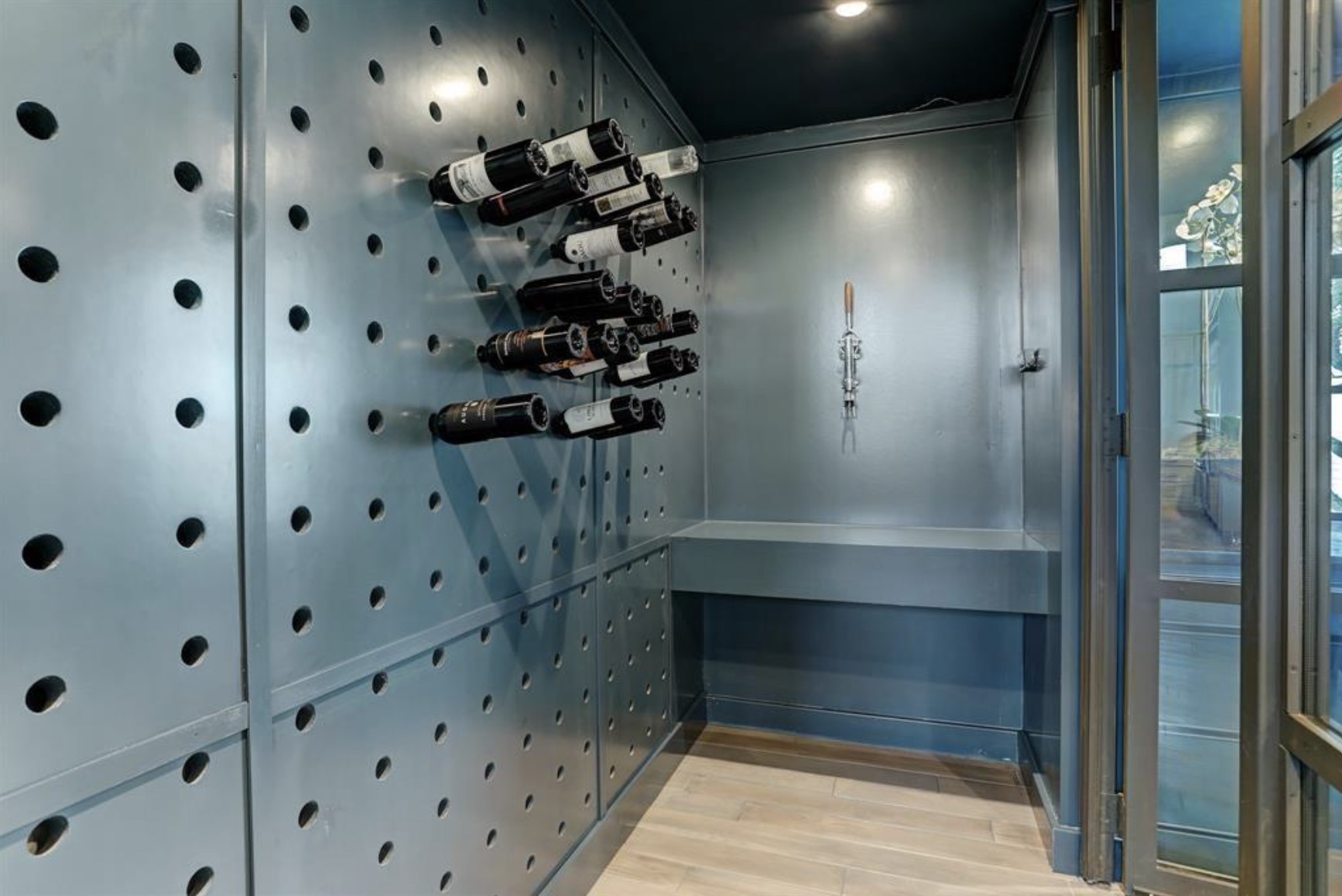 633 Quintana Roo Place Seabrook, TX 77586 - Photo 17 of 47 This above-ground, climate-controlled wine cellar has a tap for easy service and plentiful storage for all your favorite vintages.
