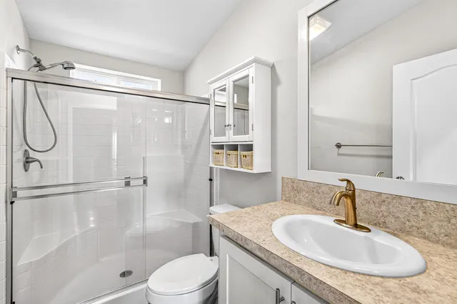 a view of a house with a wooden deck