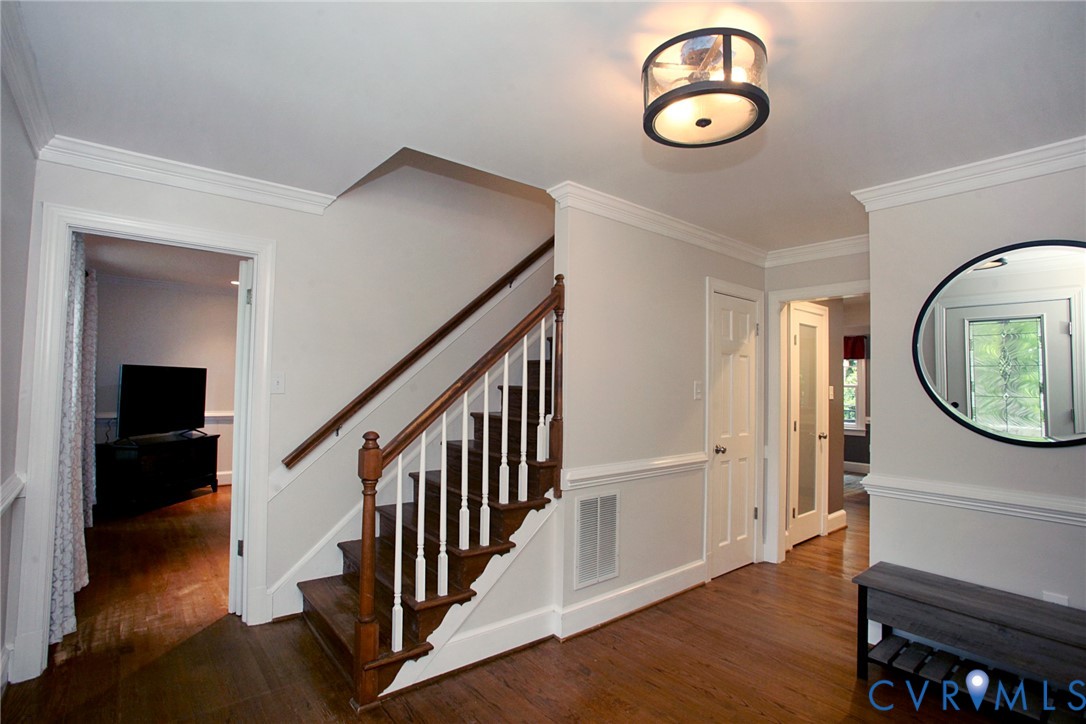 231 Hazelmere Drive Chesterfield, VA 23236 - Photo 12 of 33 a view of a hallway with wooden floor and staircase