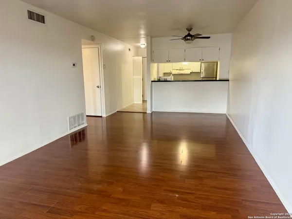 a view of a kitchen with a sink and a window