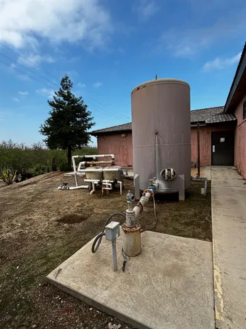 a view of a backyard with sitting area