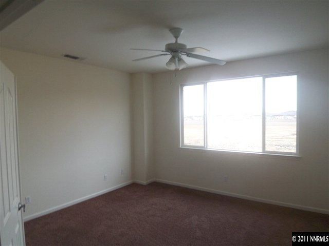 10641 Fire Poppy Circle Reno, NV 89521 - Photo 8 of 13 an empty room with a window