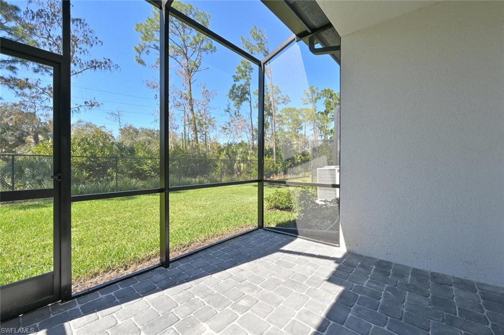 7611 Morgan Way Naples, FL 34119 - Photo 19 of 26 a view of a room with window