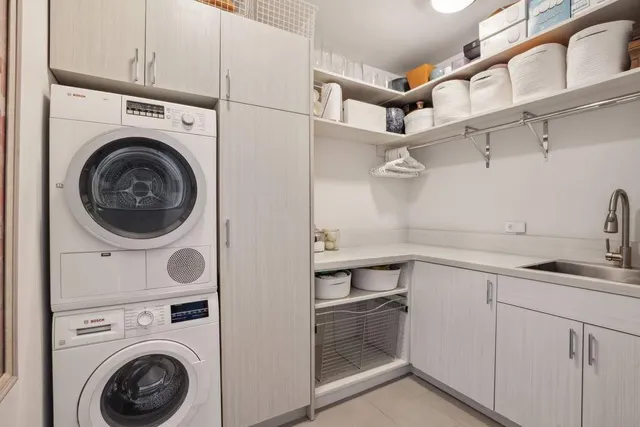 a view of a workspace with furniture and a book shelf