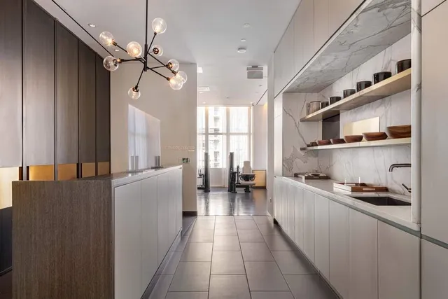 a utility room with sink dryer and washer