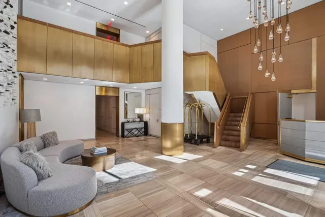 a room with furniture pool table and windows