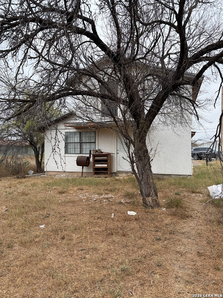 3148 Leonel Street Eagle Pass, TX 78852 - Photo 15 of 18 a car parked in front of a white house