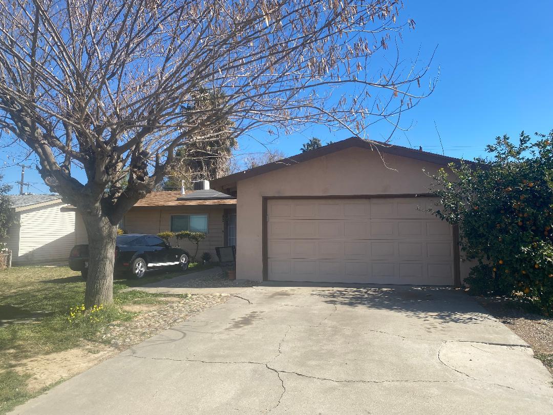 a house with a tree in the background